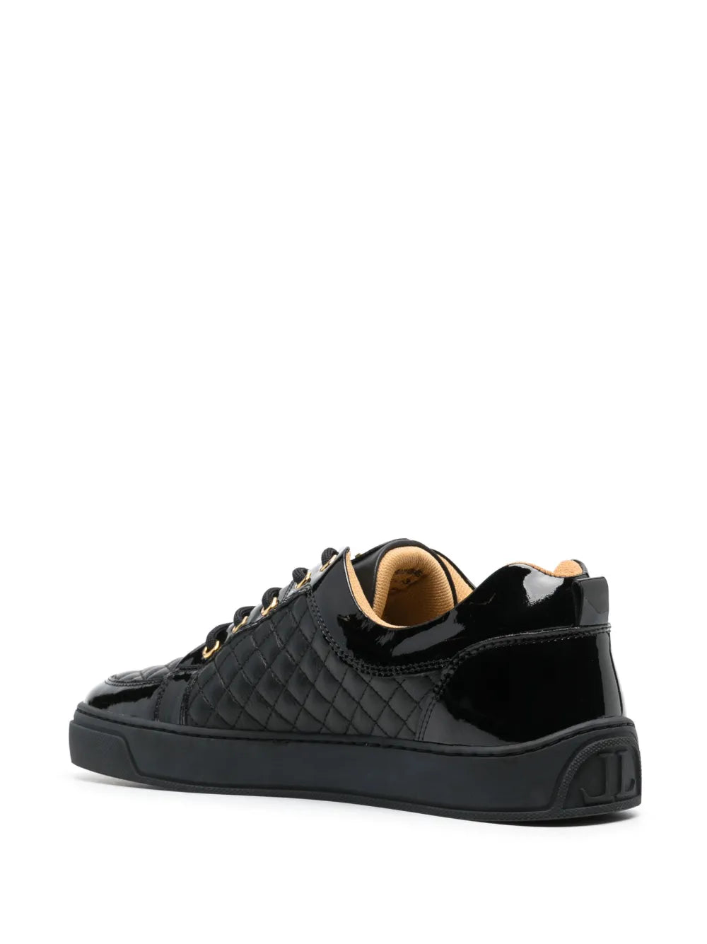 Black quilted low-top sneakers with padded collar, lace-up design, thick sole