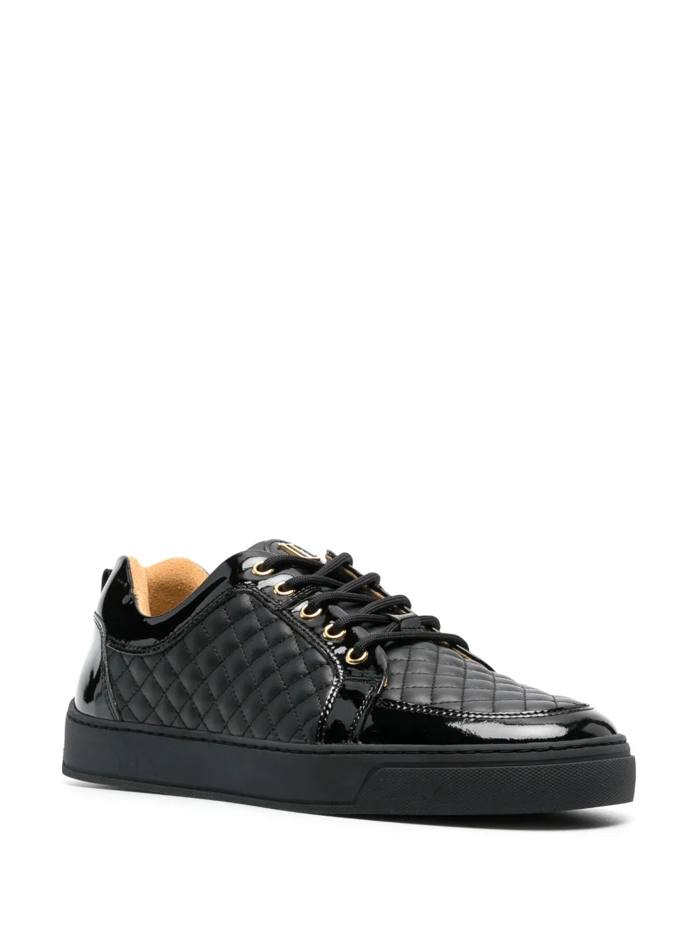 Black quilted low-top sneakers with glossy side panel and gold lace accents