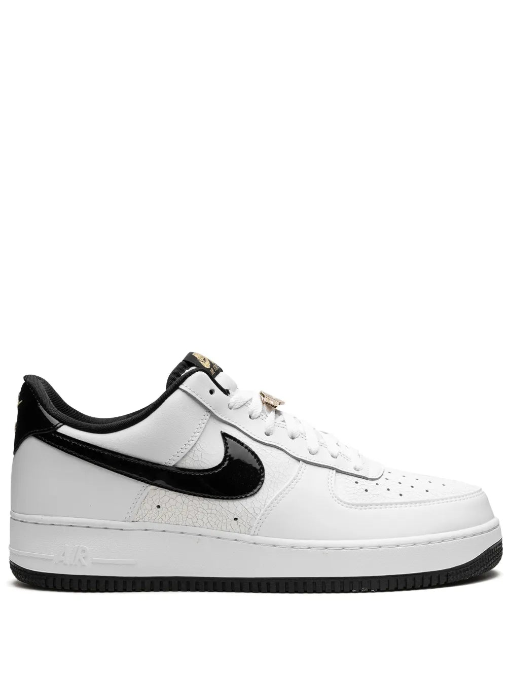 White Nike Air Force 1 sneakers with black swoosh, lace-up front, perforated toe