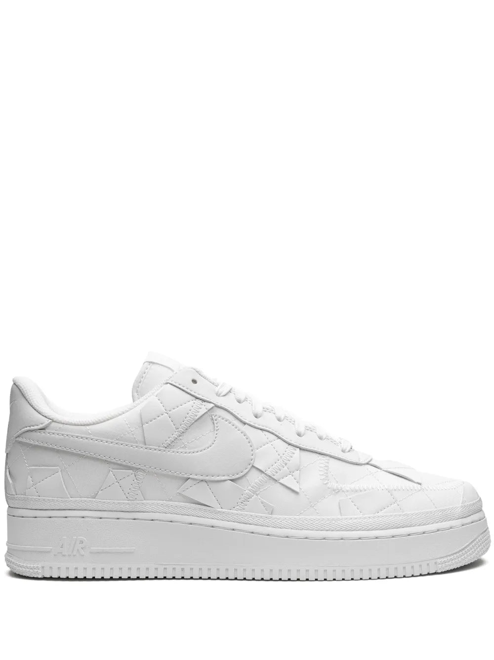 White low-top leather sneakers with Nike swoosh and lace-up front