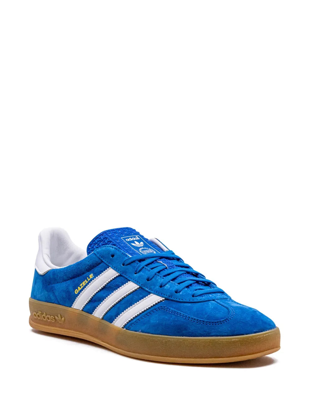 Blue adidas low-top sneakers with white triple stripes, lace-up front, gum sole