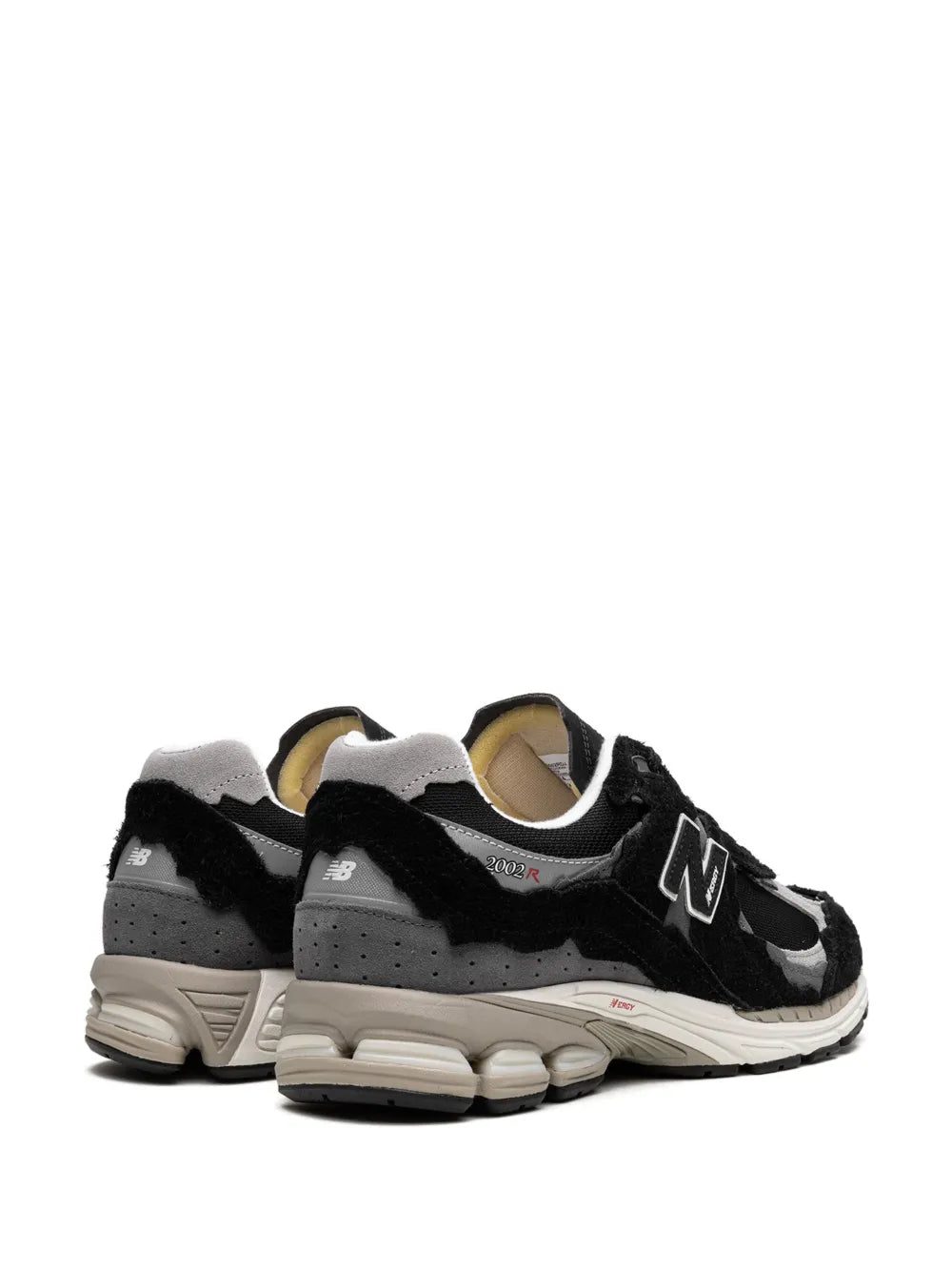 Black sneakers with grey panels, white N logo, and cushioned collar