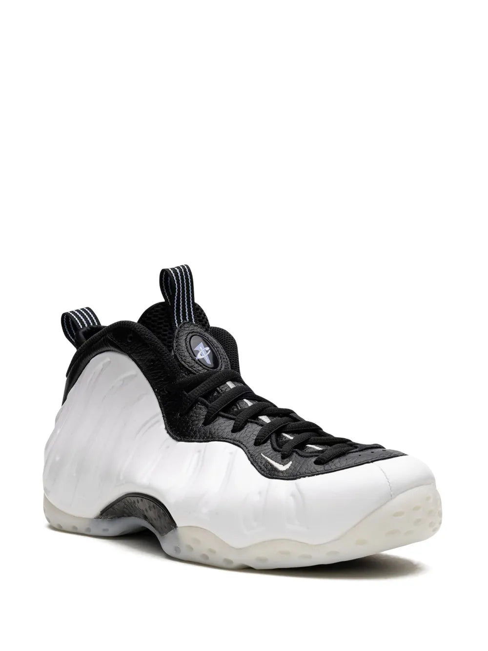 Black upper and white basketball sneakers with lace-up front and foam-style shell
