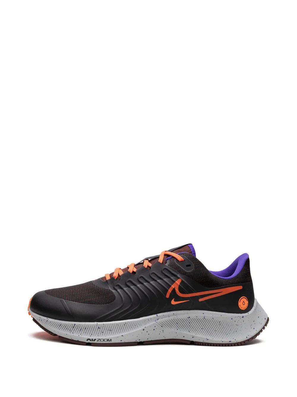 Nike running shoe front side with black mesh upper, orange laces and swoosh, speckled sole