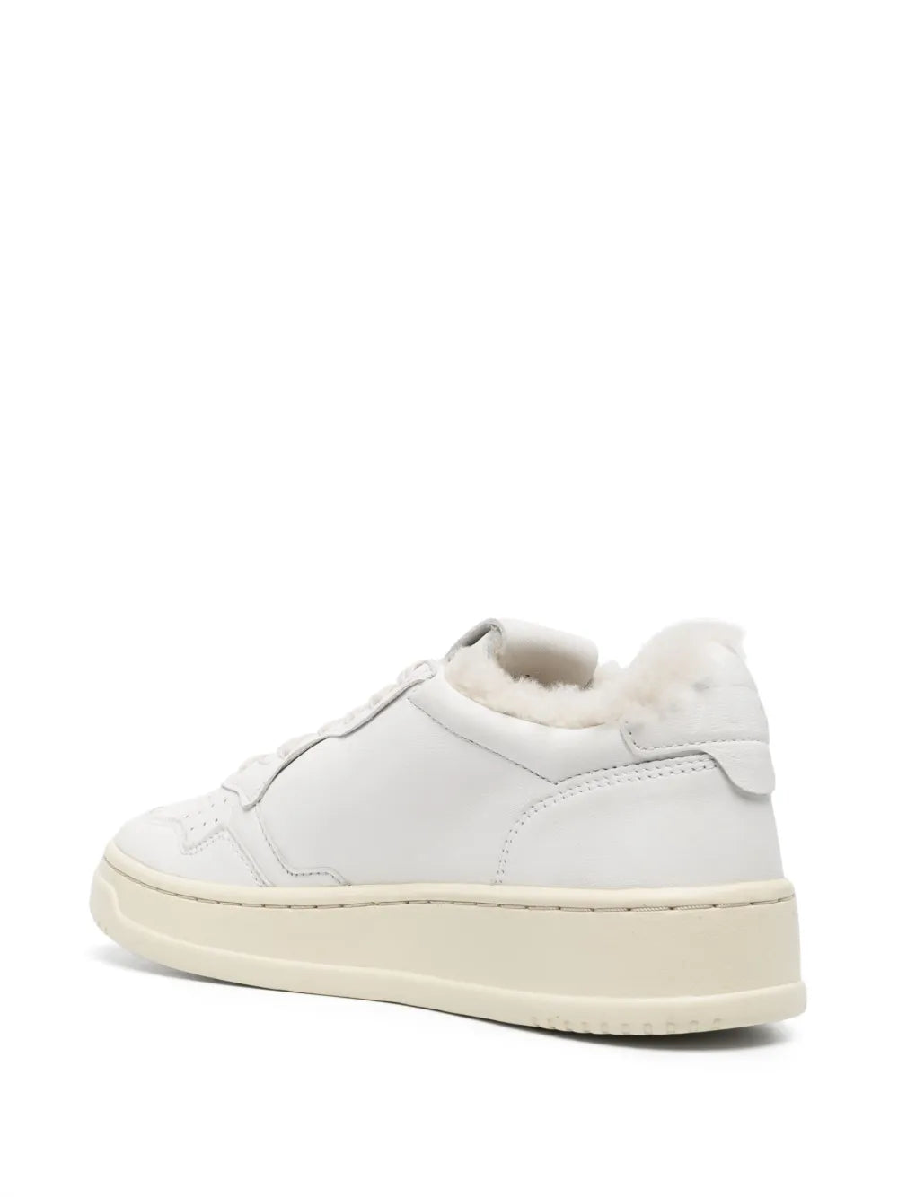 Autry white low-top sneaker with shearling-lined ankle and thick sole