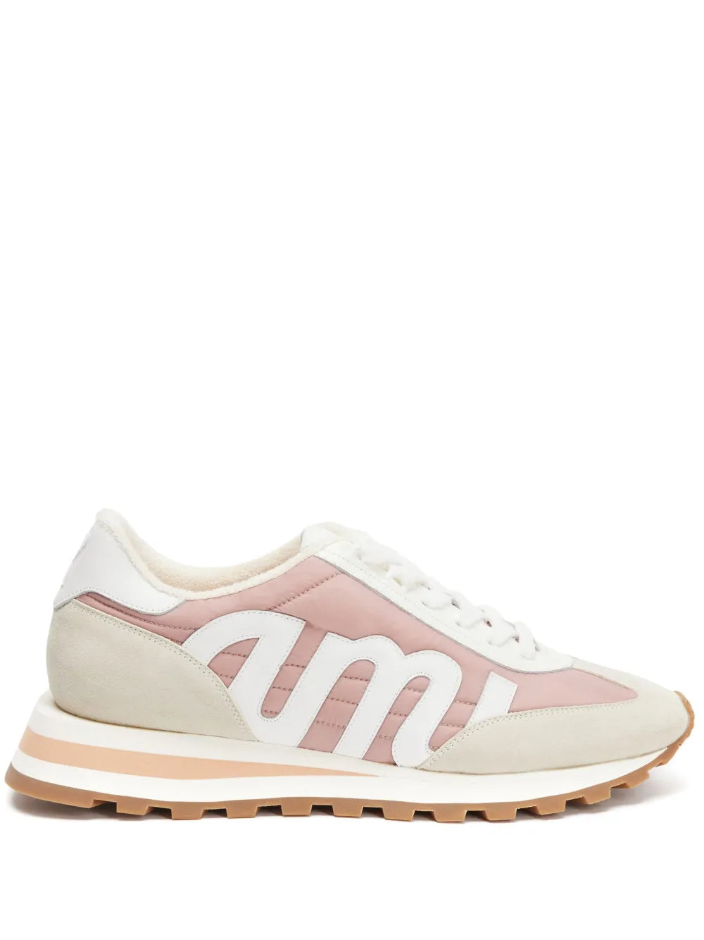 Light beige and pink sneakers with white laces and chunky tan tread sole