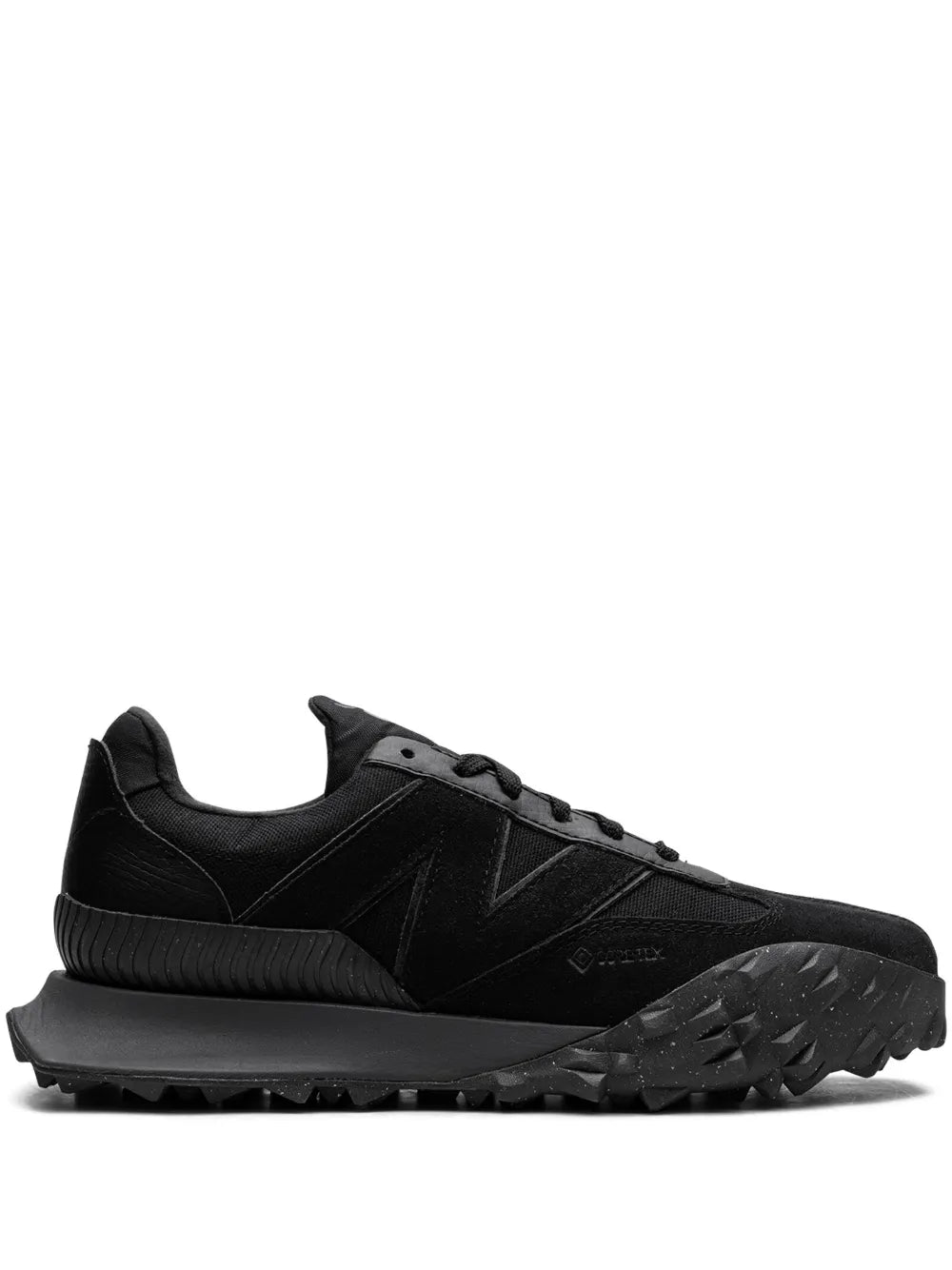 Black lace-up New Balance XC72 D low-top sneaker with chunky treaded rubber sole