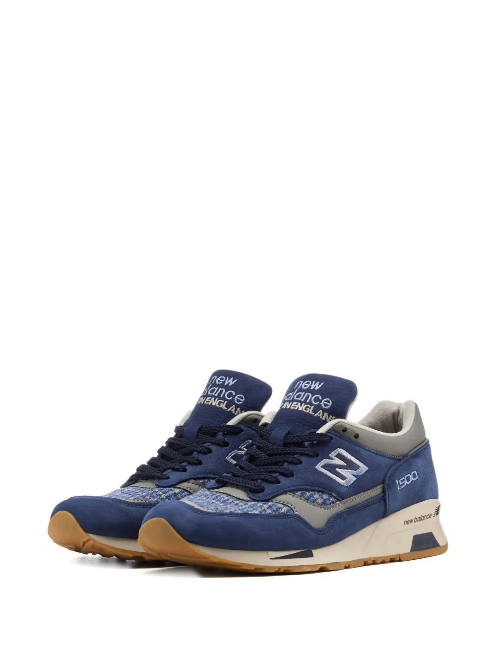 New Balance 1500 navy and cream sneakers, side view with lace eyelets and N logo