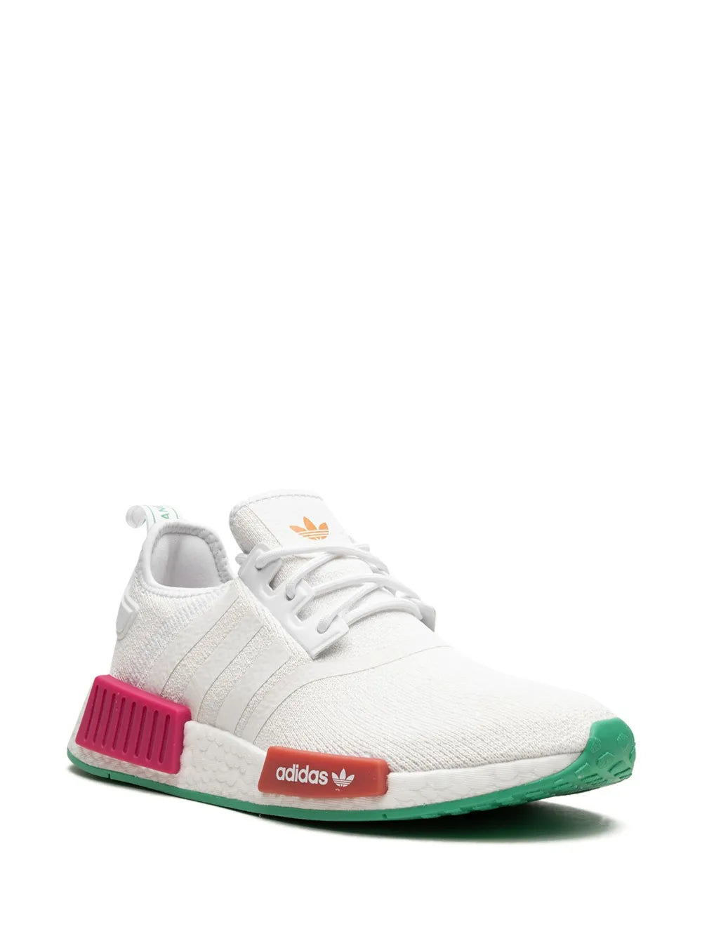 White adidas sneaker, angled side view, pink midfoot block, green outsole