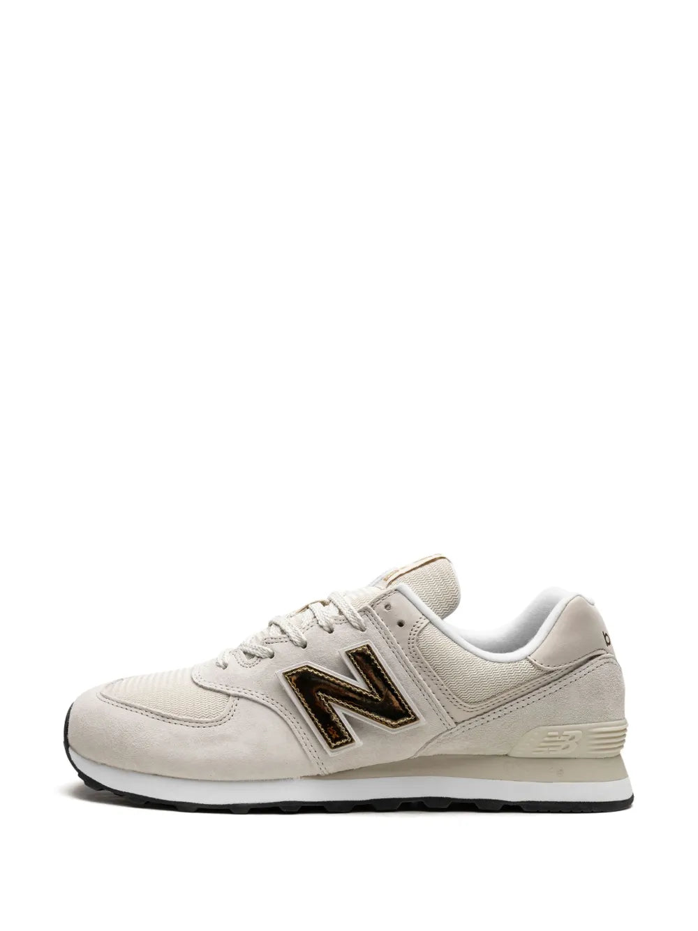 New Balance 574 off-white lace-up sneakers with black “N” logo and light grey midsole strip