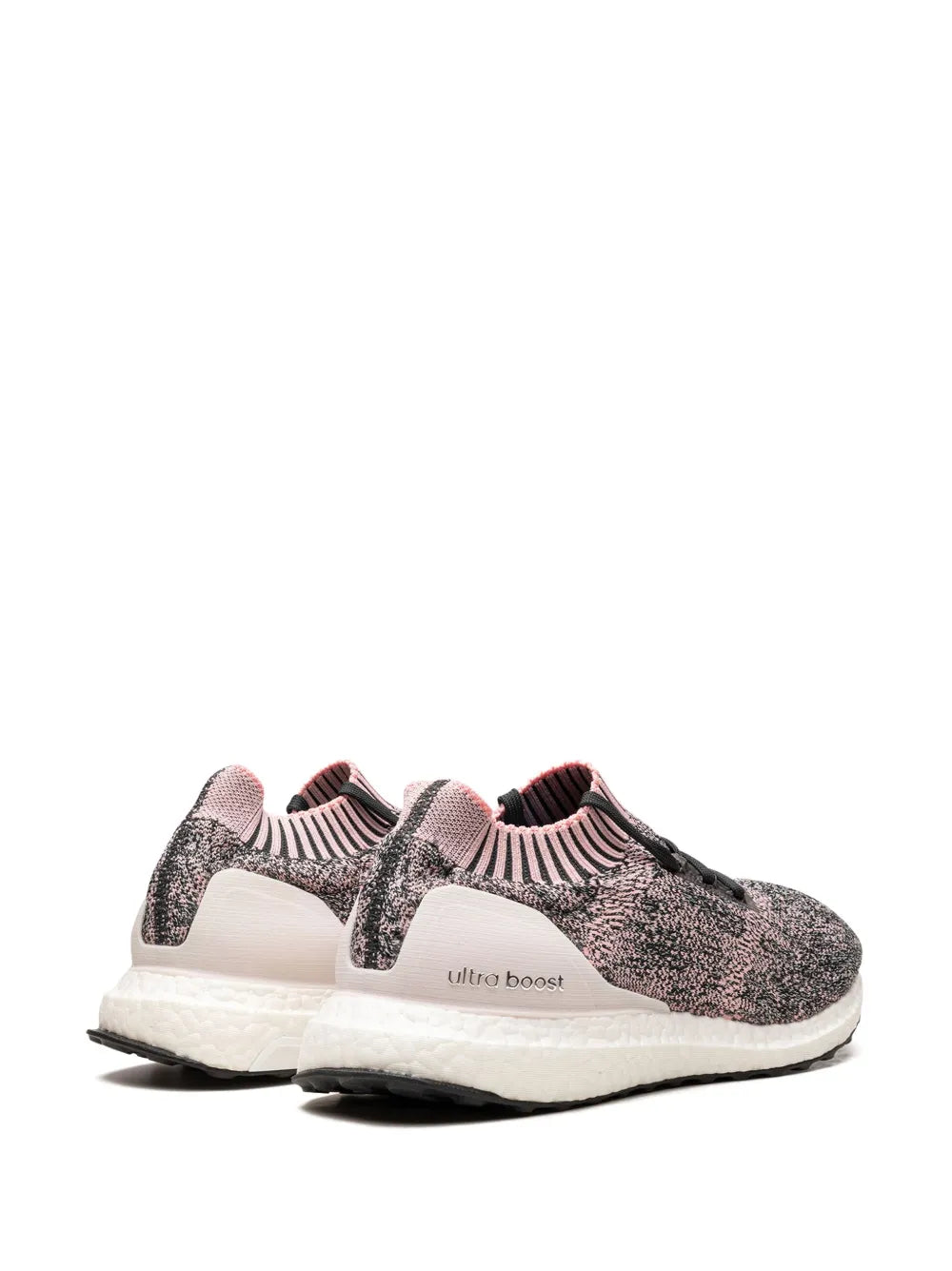Uncaged knit running shoe, speckled black upper, pink collar, white cushioned sole