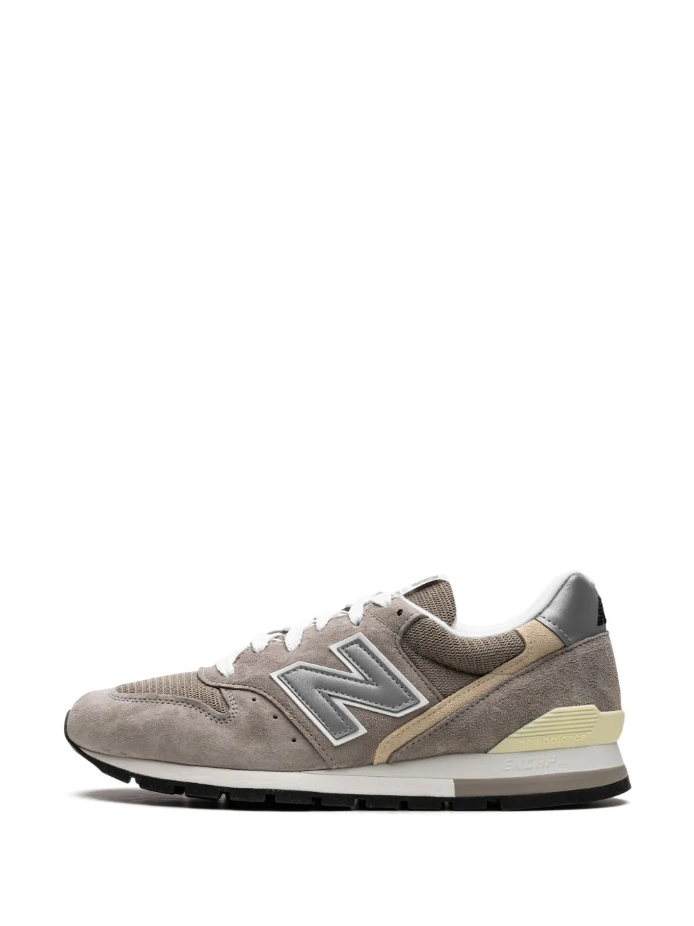 Grey low-top sneaker with N logo, beige accent midsole, and white lace-up