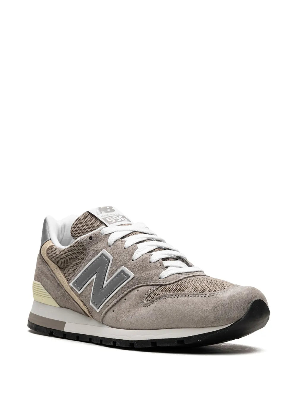Grey low-top sneaker with large N side logo, white laces, and black rubber outsole