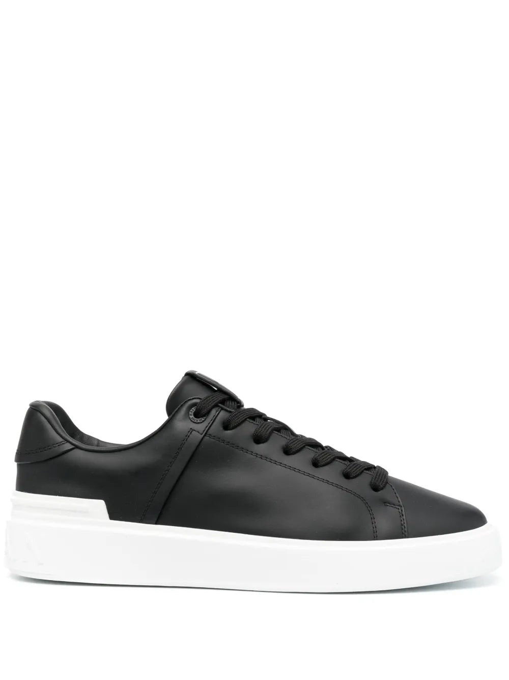 Black low-top leather sneakers with white rubber sole and lace-up front