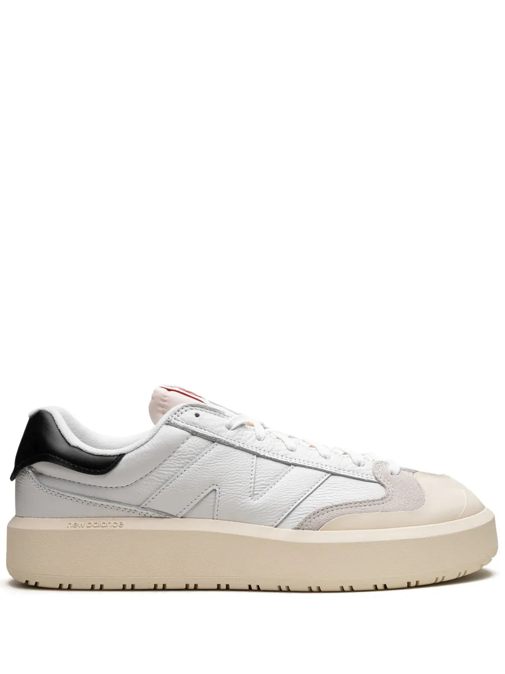 White leather low-top sneaker with black heel tab, lace-up, tan rubber sole