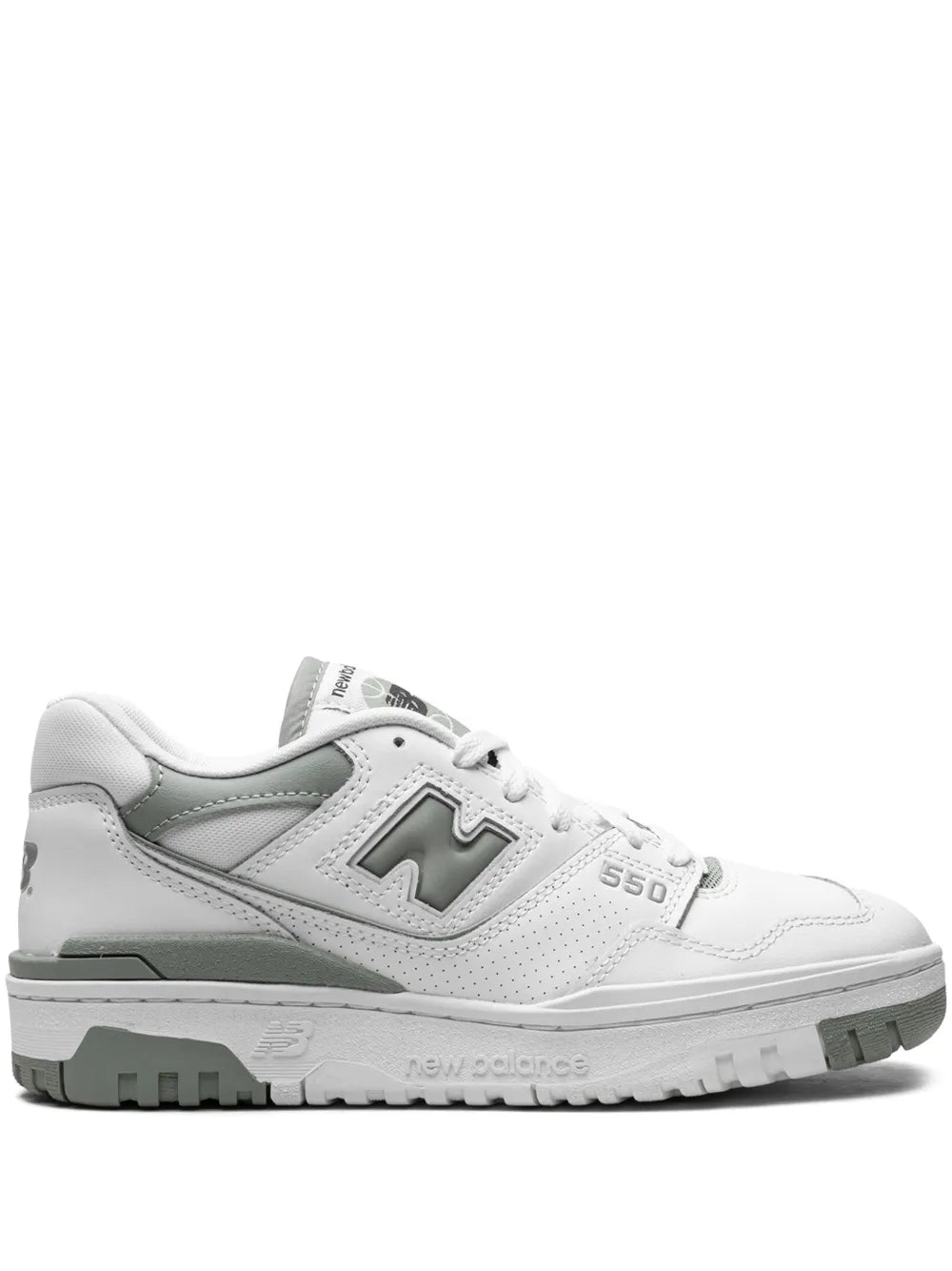 White New Balance 550 low-top sneakers with green accents, lace-up and cushioned sole