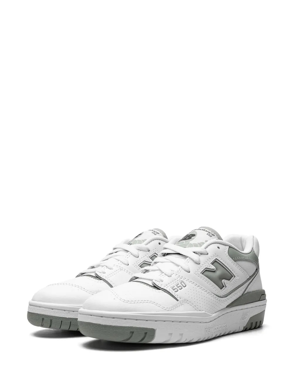 Pair of white low-top sneakers with green logos, lace-up design and cushioned sole