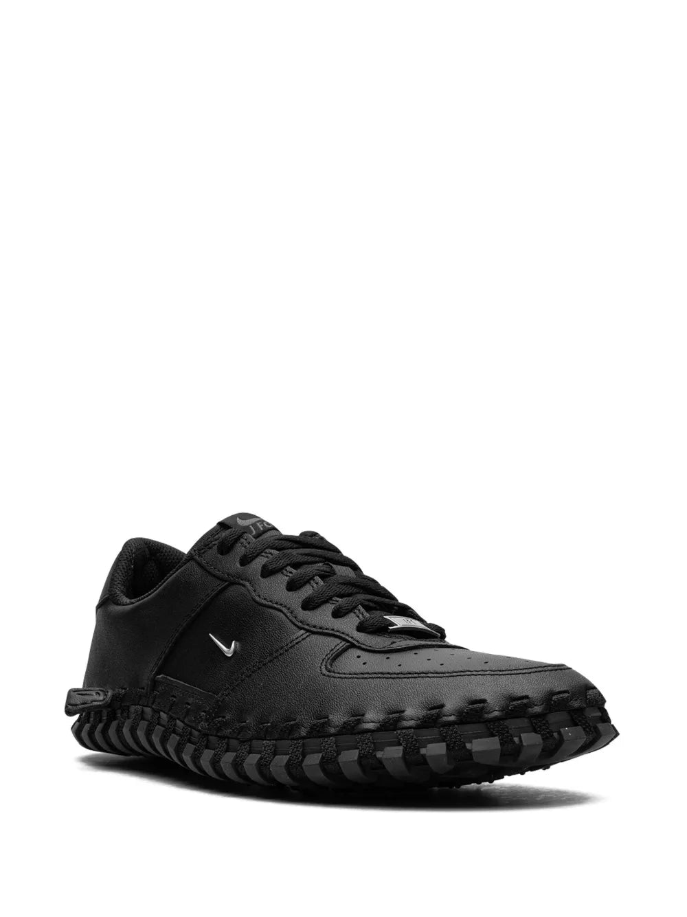 Black low-top lace-up sneaker with Nike Swoosh and rugged tread sole