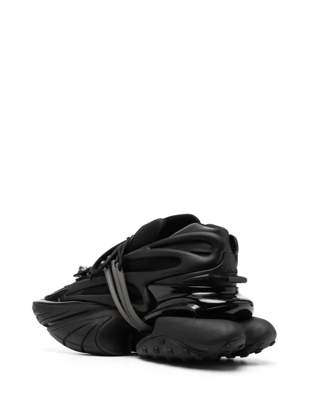 Balmain black low-top sneakers, angled view with lace-up closure and molded outsole