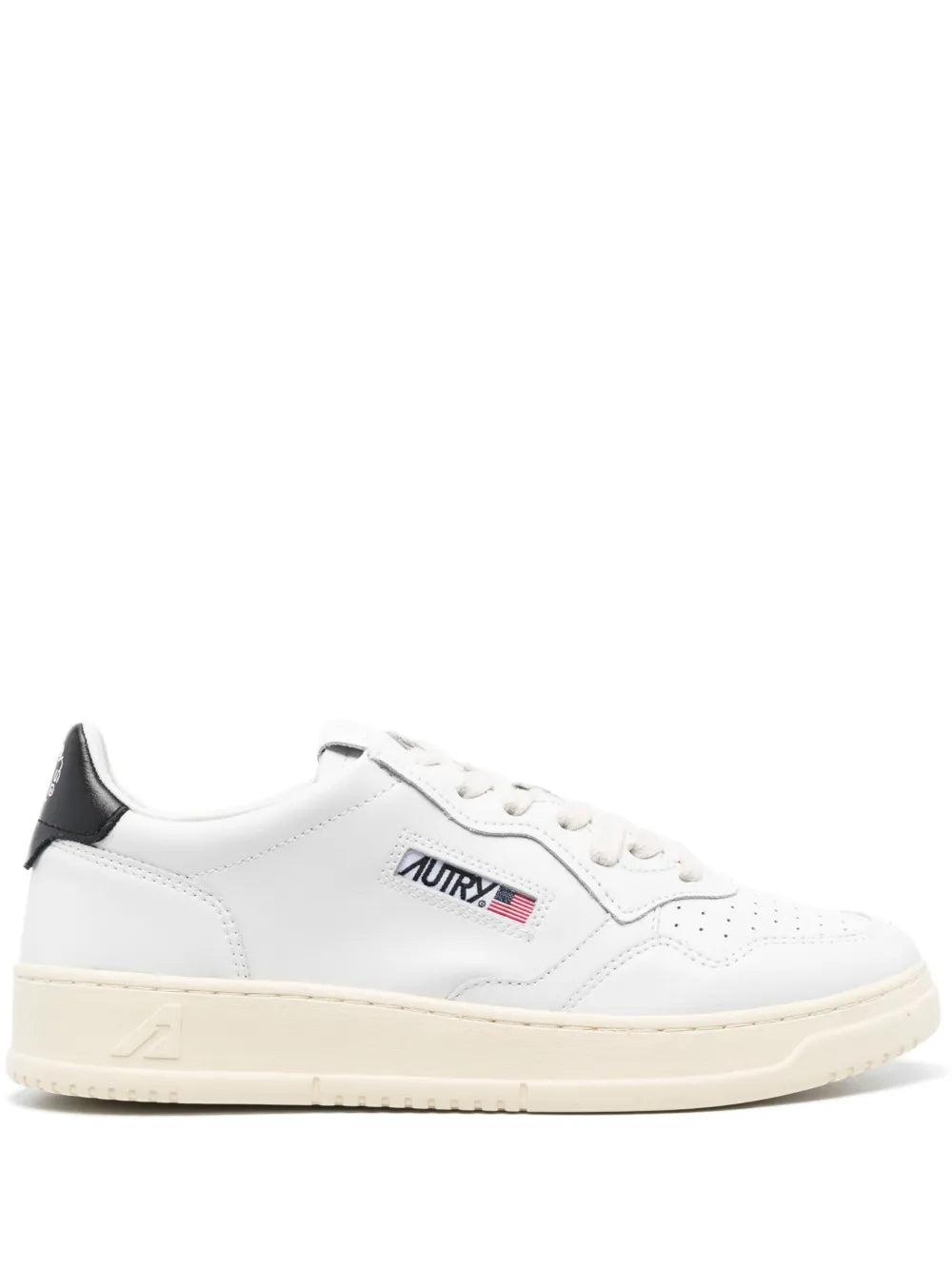 White lace-up low-top sneakers with black heel tab and cream rubber sole