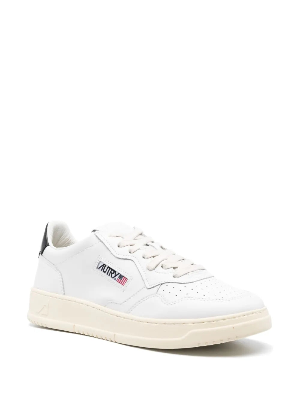 White leather lace-up low-top sneakers with black logo patch and cream sole
