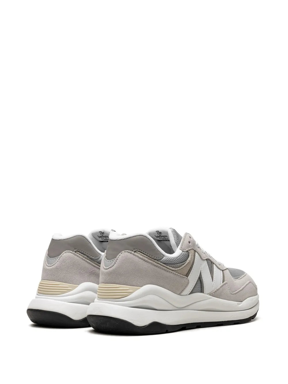 New Balance 57/40 grey-and-white sneakers, rear quarter view, cushioned midsole