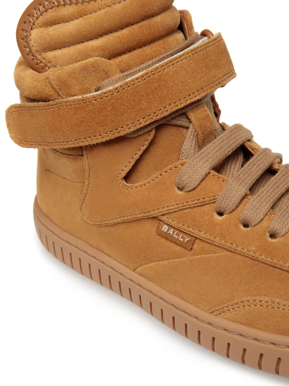 Brown suede high-top sneaker close-up, padded collar, Bally logo, and lace-up ties