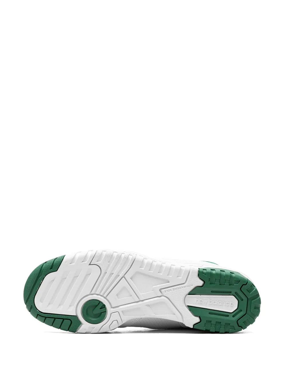 White sneaker outsole with green traction pods and molded tread pattern