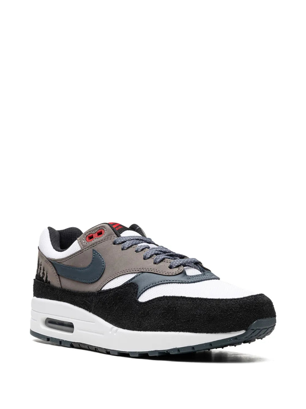Nike Air Max 1 sneakers side view, white upper with blue Swoosh and black toe
