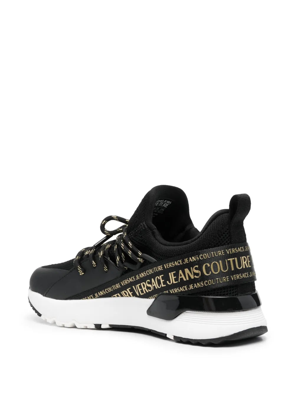 Black lace-up low-top sneakers with gold logo band and sculpted white sole
