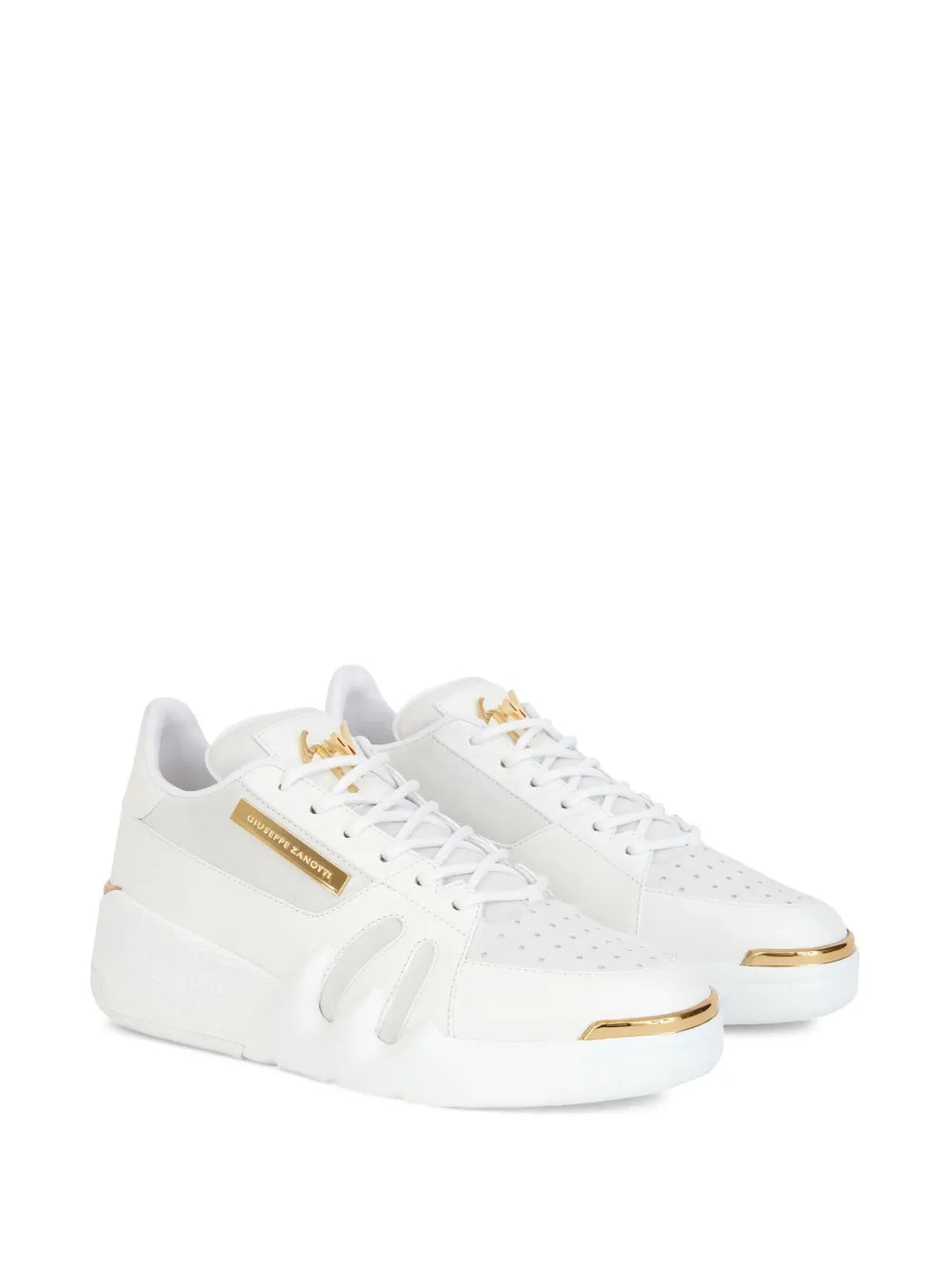 White leather lace-up sneakers with gold logo patch and thick sole