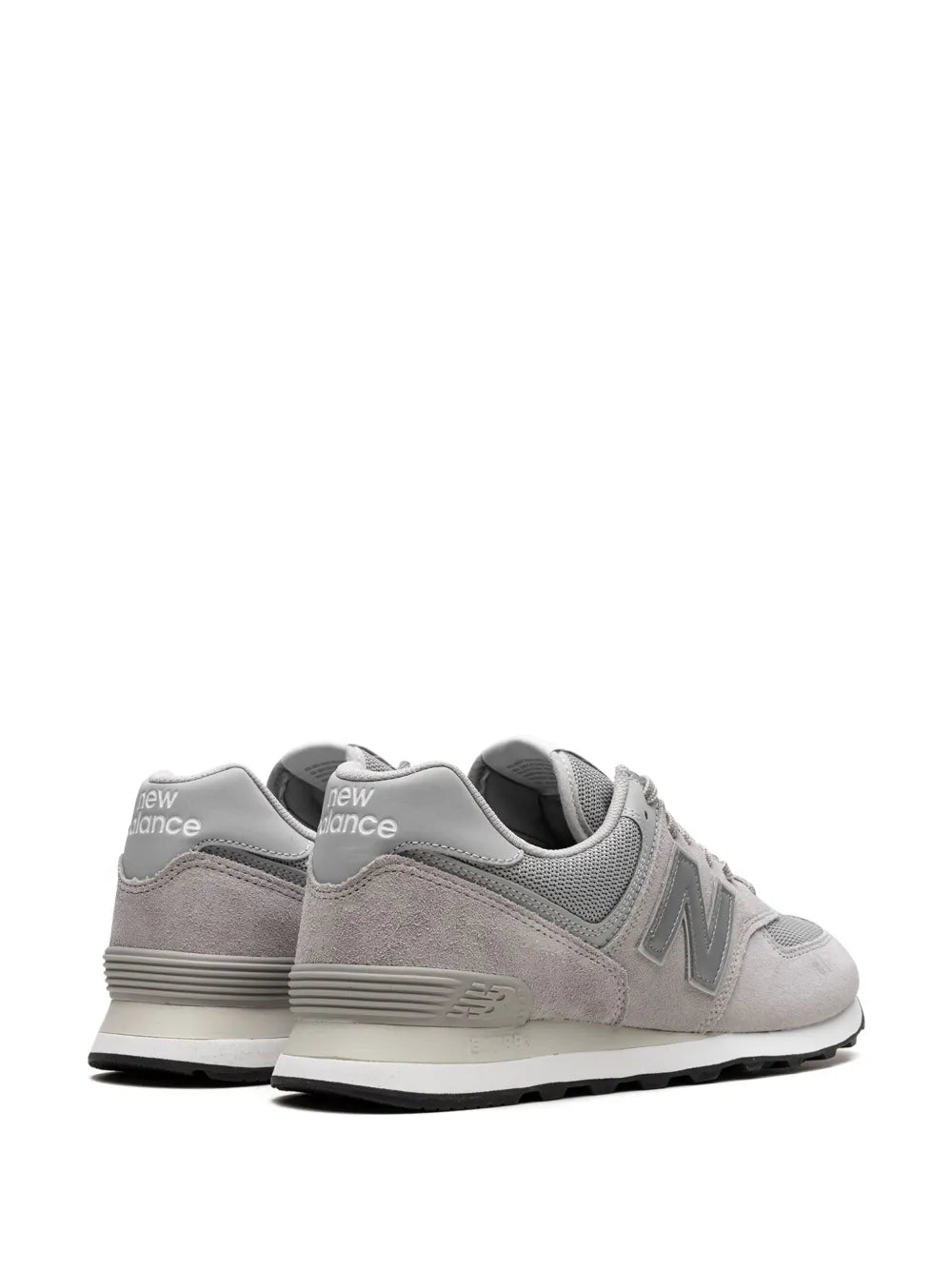 Light gray sneakers with rear New Balance branding, cushioned heel, lace-up