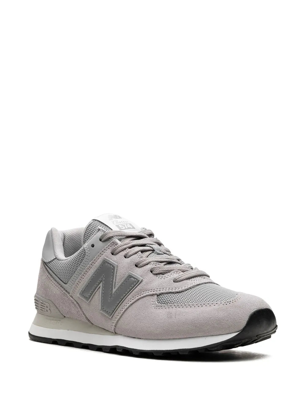 Light gray lace-up sneakers with mesh tongue and suede panels, side view