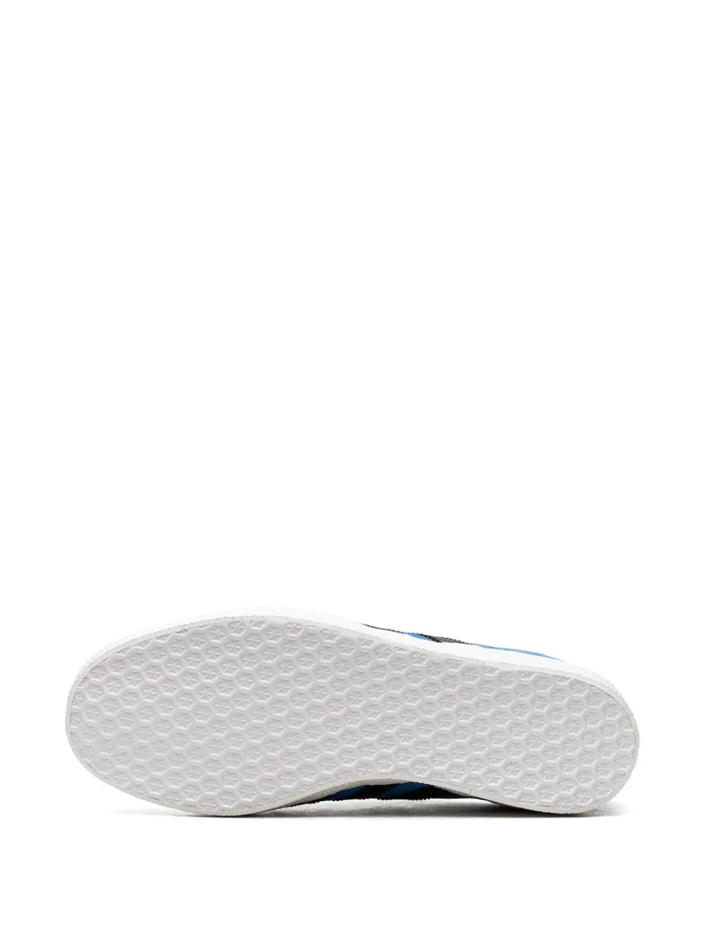 Blue sneaker outsole with textured white rubber tread and black edge