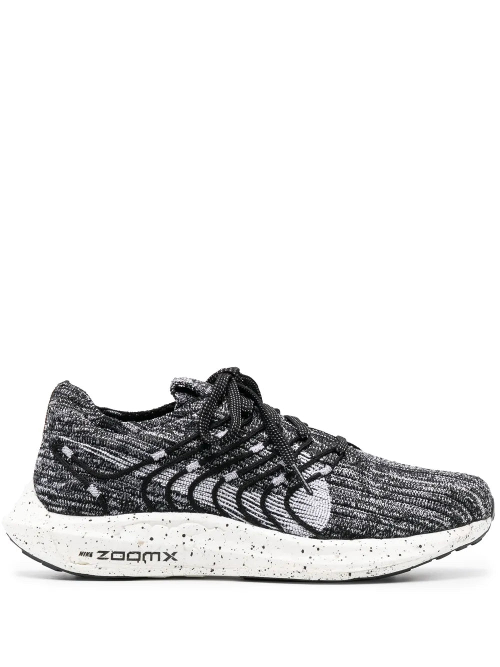 Nike knit running shoe in black and white, lace-up with white speckled midsole