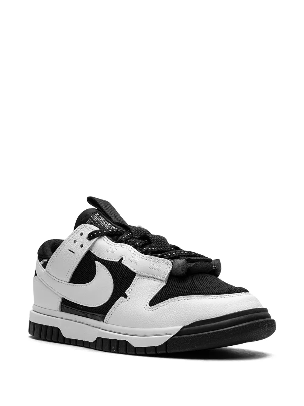 Nike Air Dunk Low sneakers, side view in black and white with lace straps
