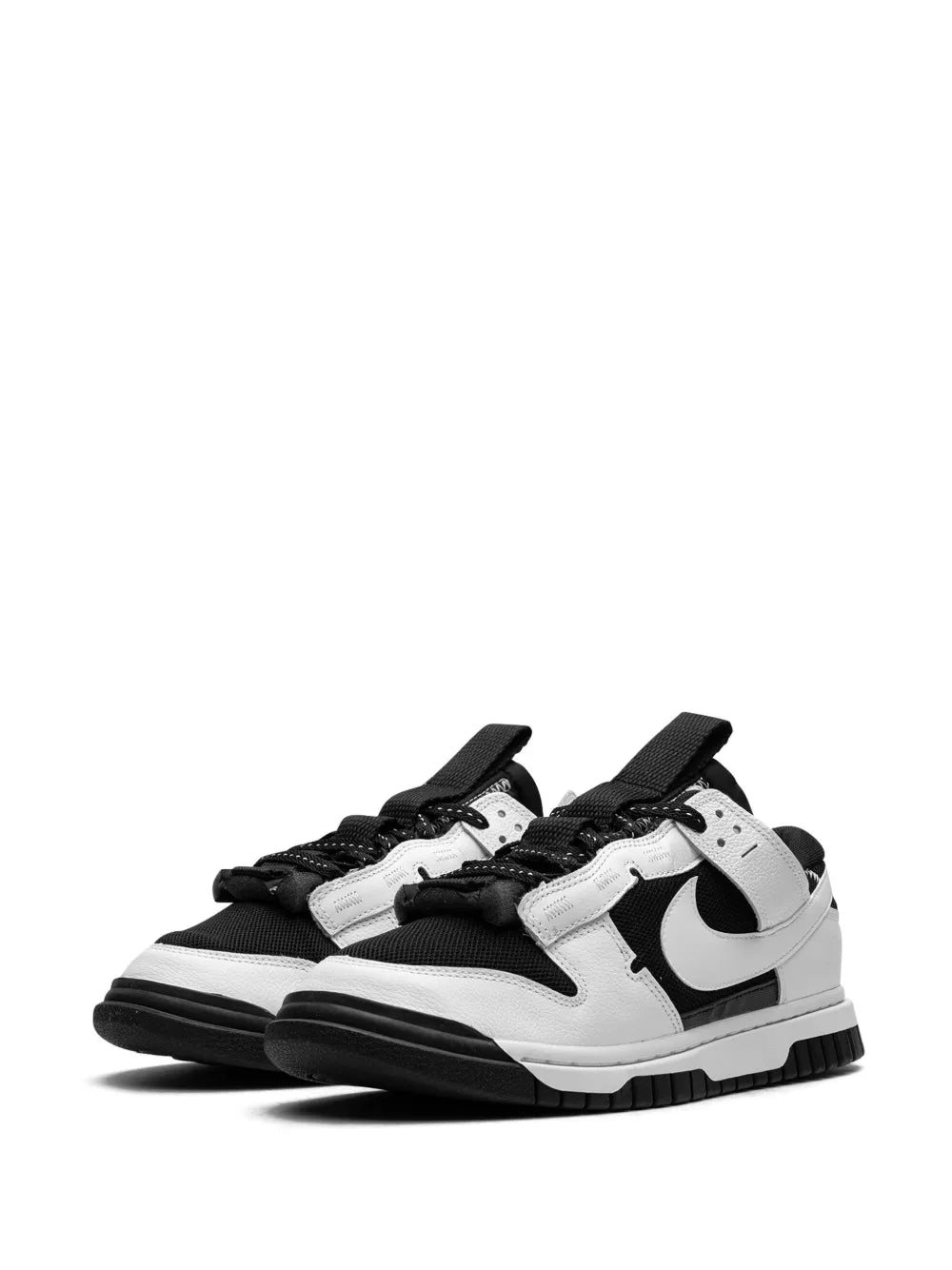 Nike Air Dunk Low sneakers, angled side view in black and white with Swoosh
