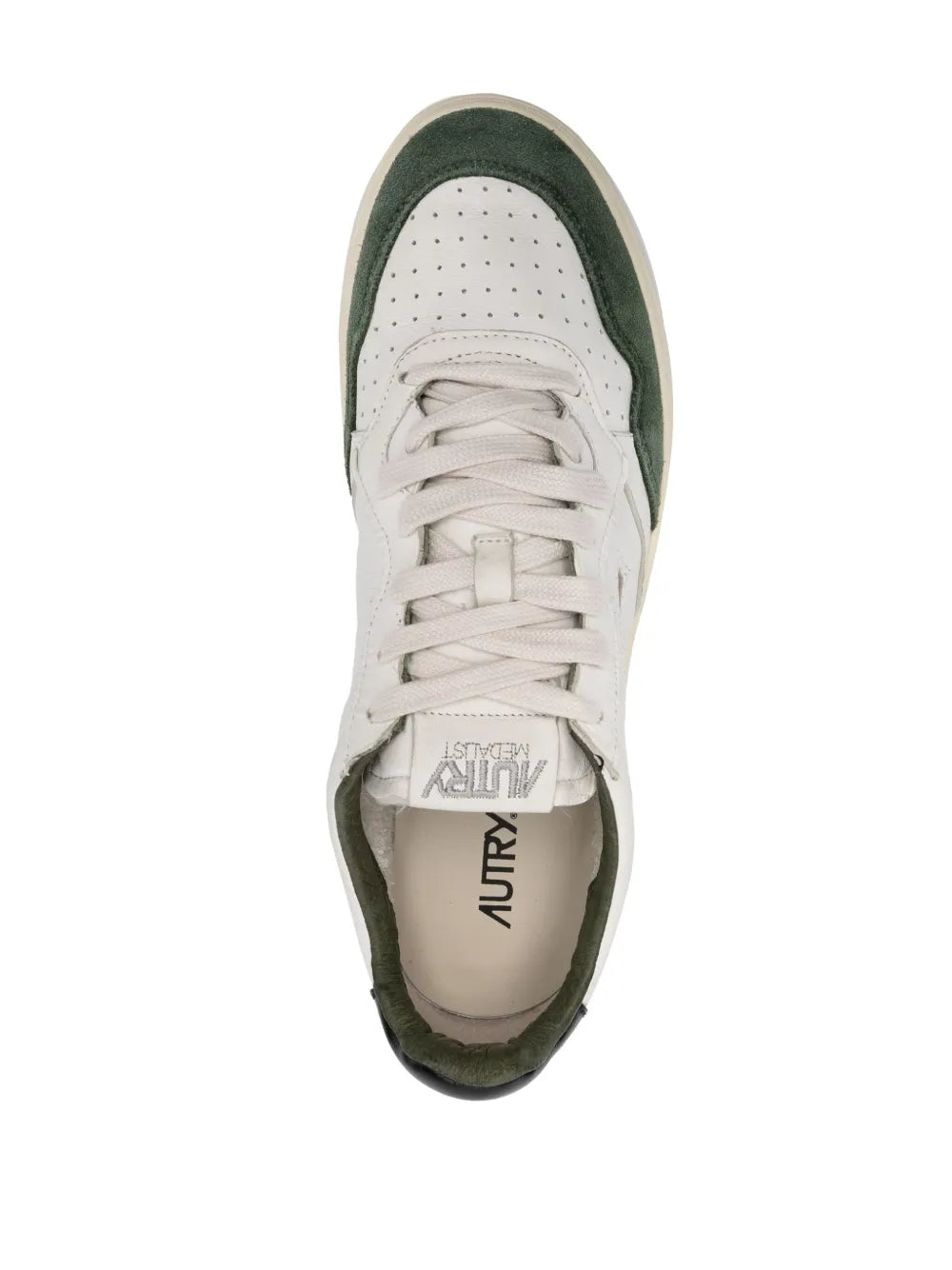 Autry low-top sneaker view, white lace-up with dark green trim and cushioned tongue