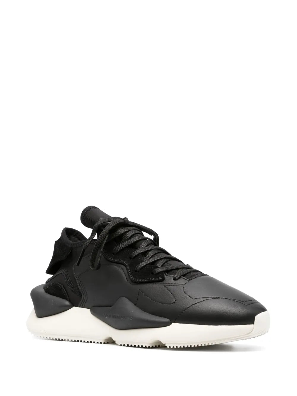 Black chunky lace-up sneaker, side profile with sculpted panels and white sole
