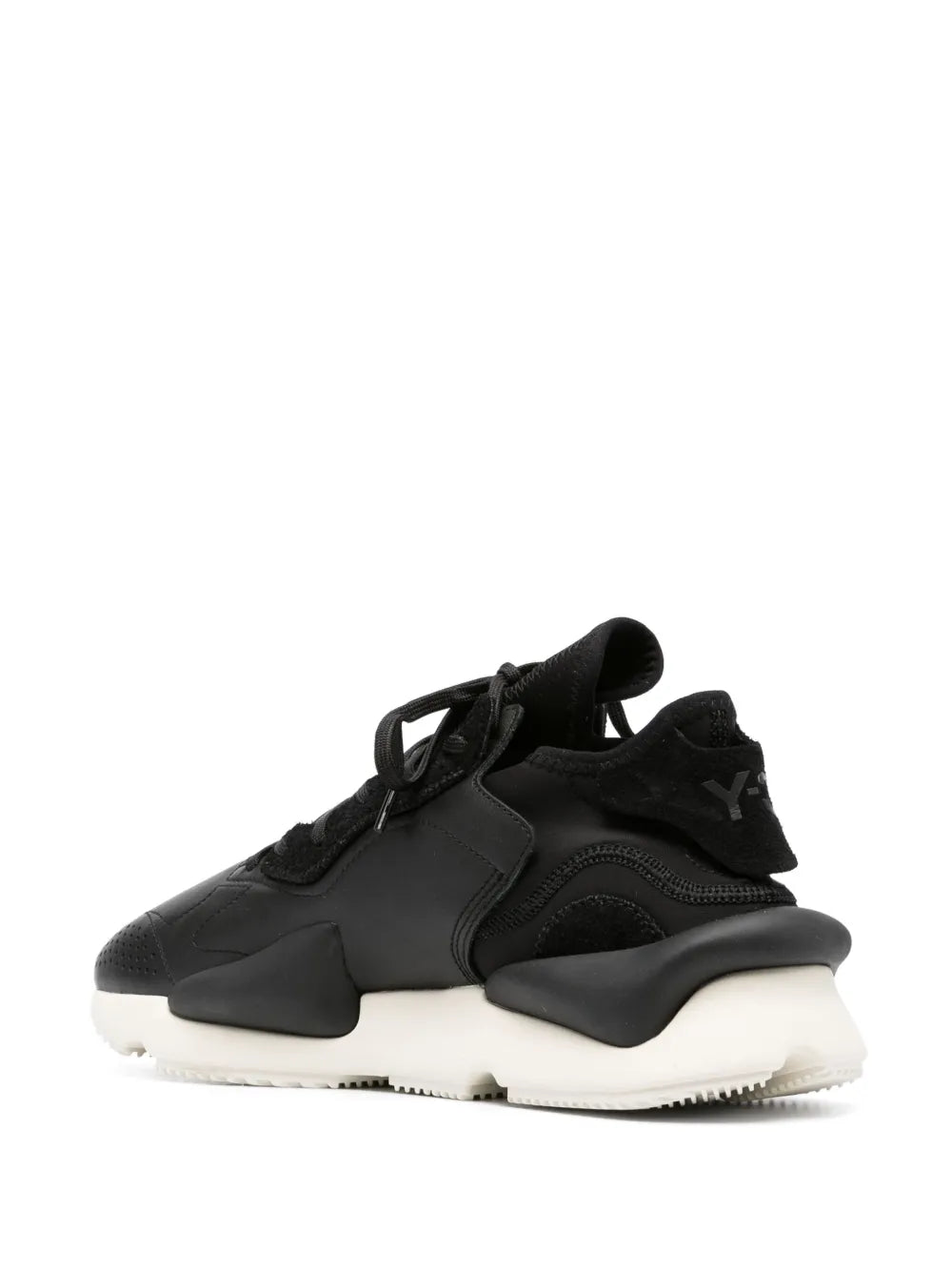 Black lace-up sneaker with high heel overlay, strap detail, and white sole