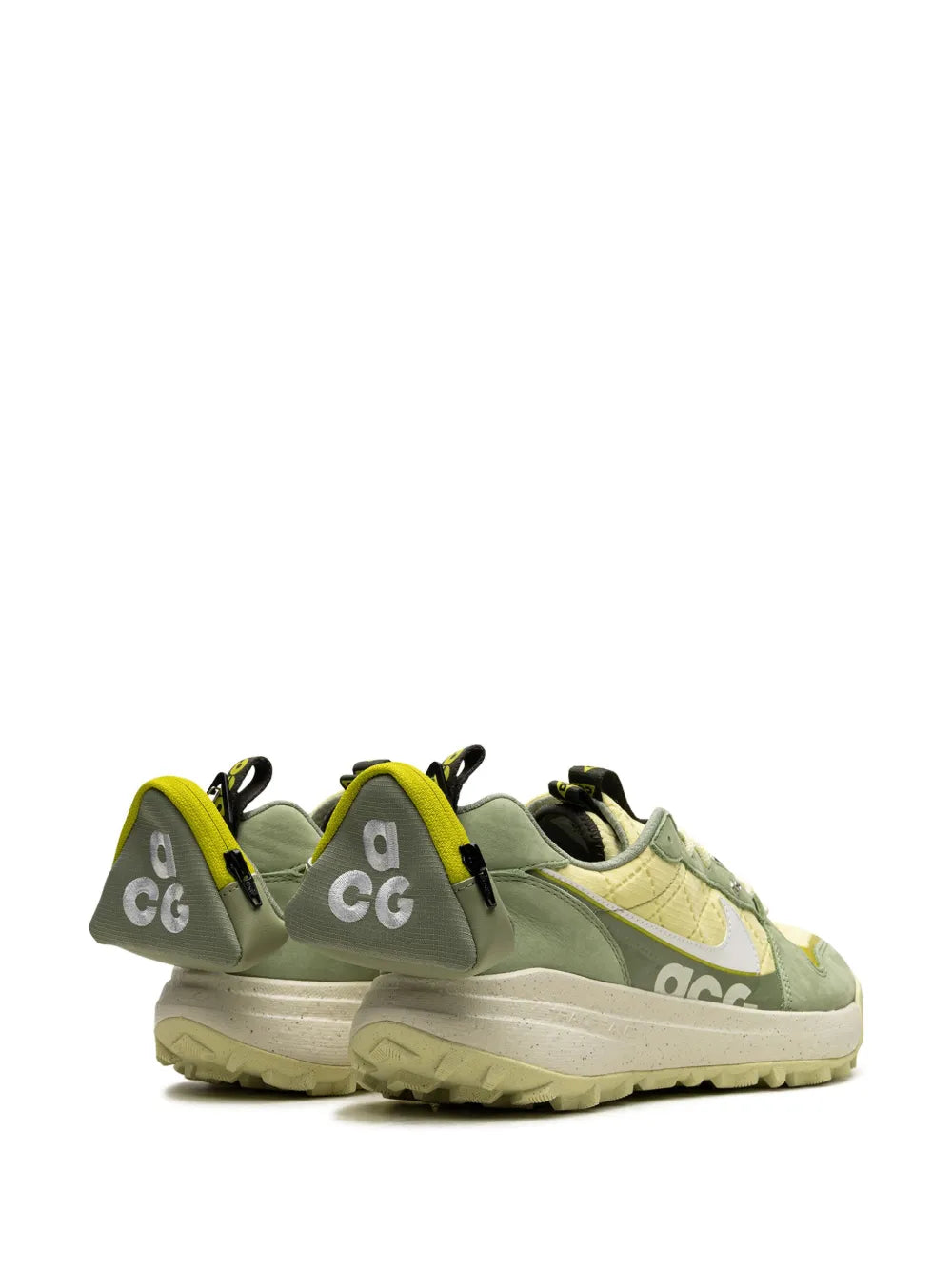 Nike ACG low-top sneakers, side view with yellow heel tab and chunky tread sole