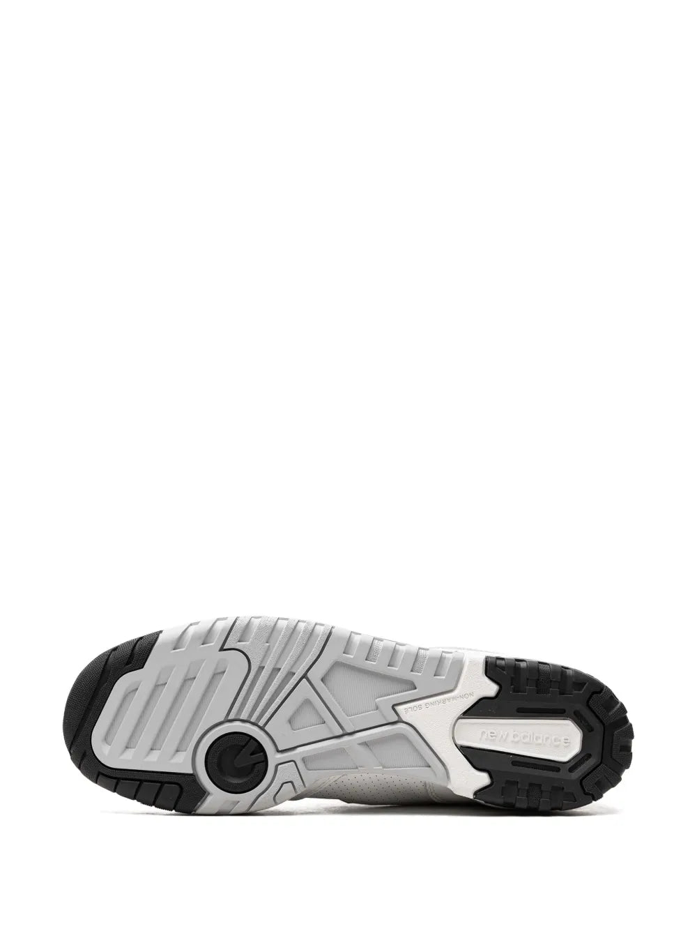 White and black high-top sneakers outsole, textured tread view