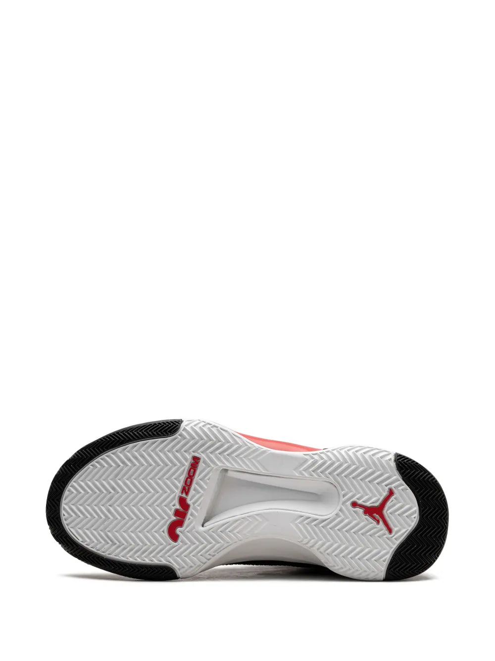Sneaker outsole with black tread, white traction pattern, and red accent