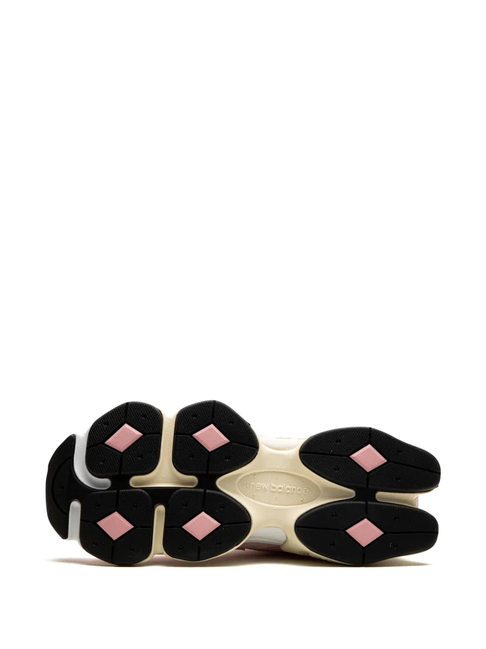 New Balance 9060 outsole tread view in beige with pink accents