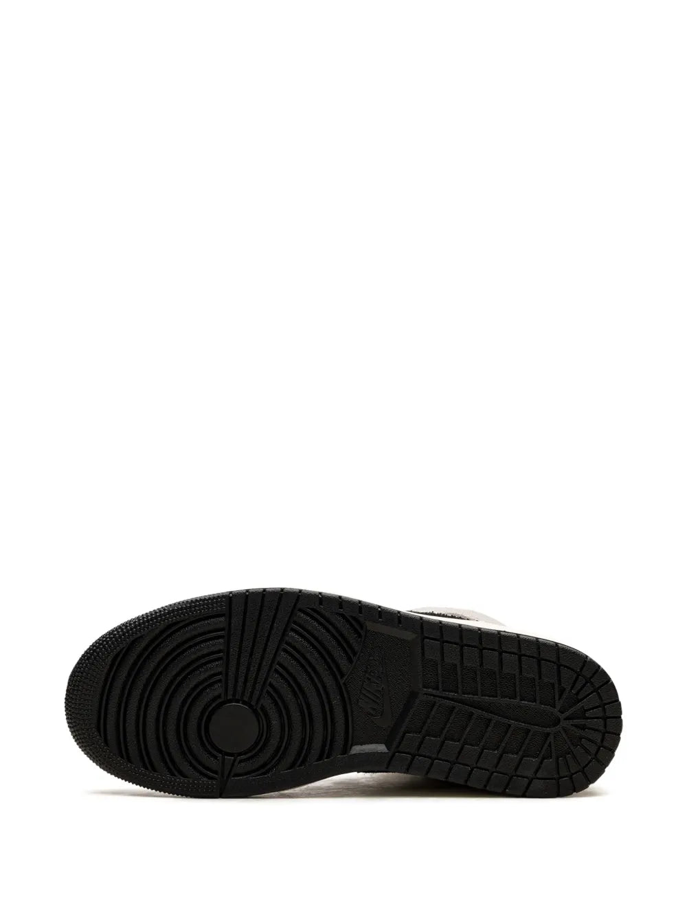 Sneaker outsole view with black rubber tread and circular traction pattern