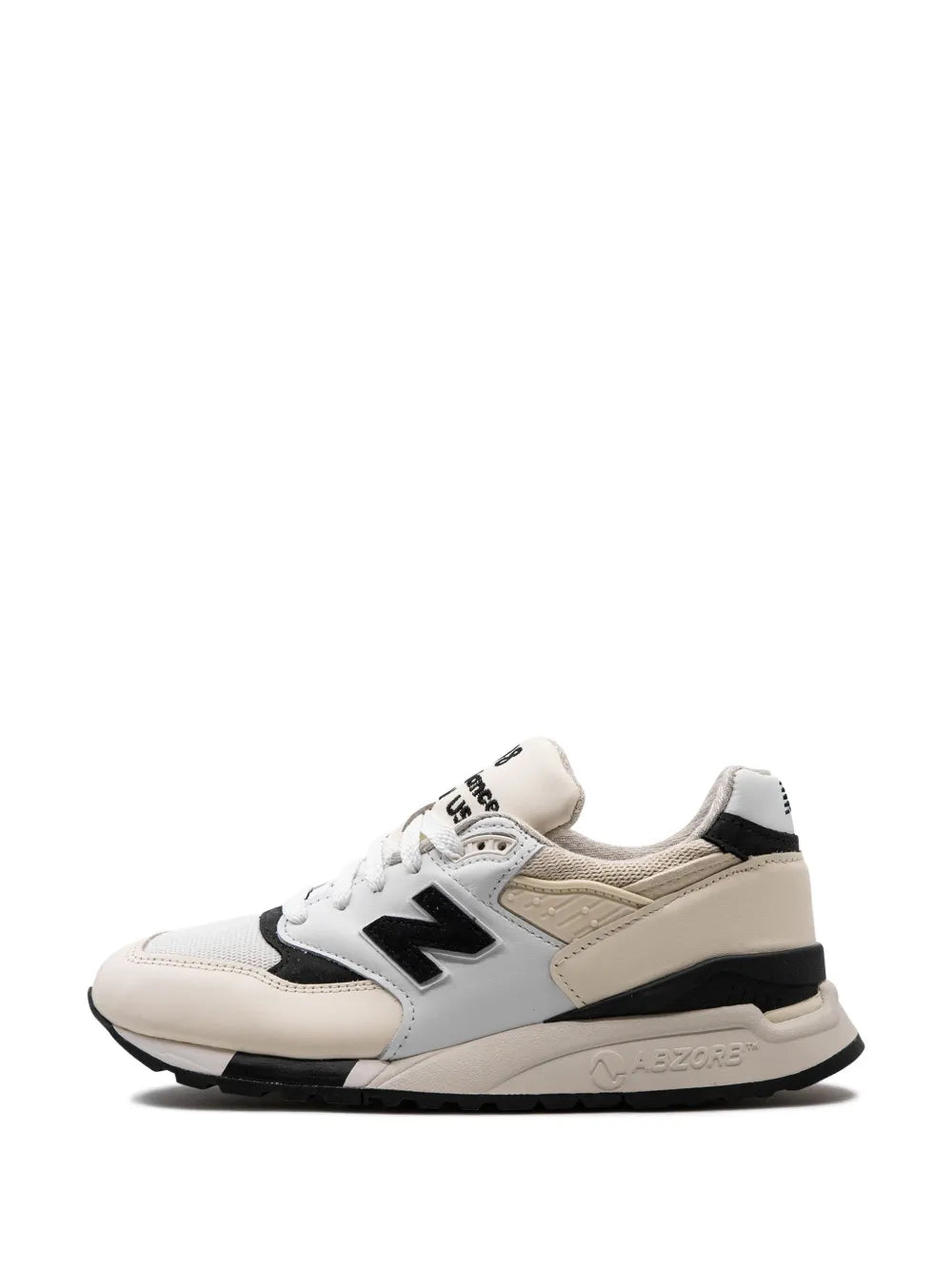 Made-in-USA sneakers, side view with black N logo and cream panel accents