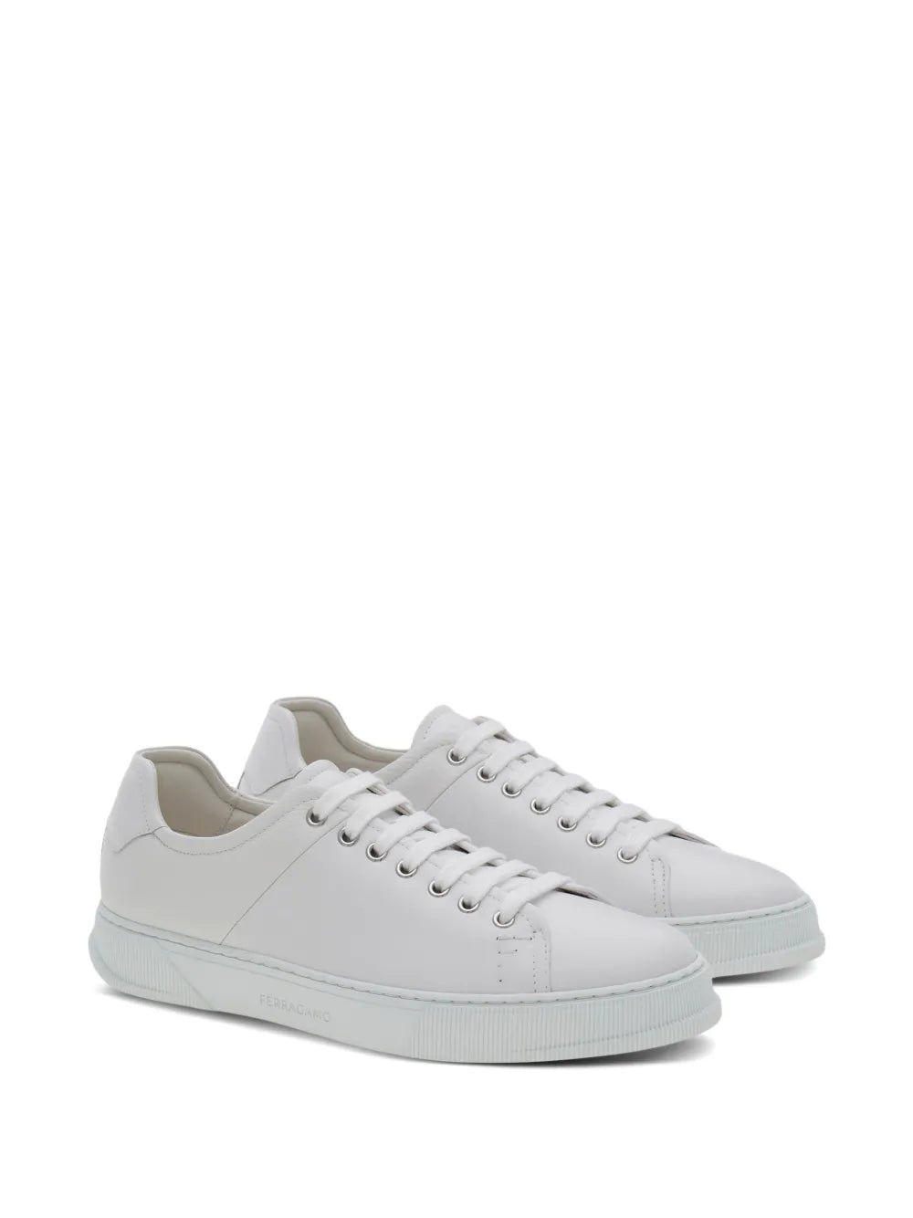 White leather lace-up sneakers, side view, light blue rubber sole