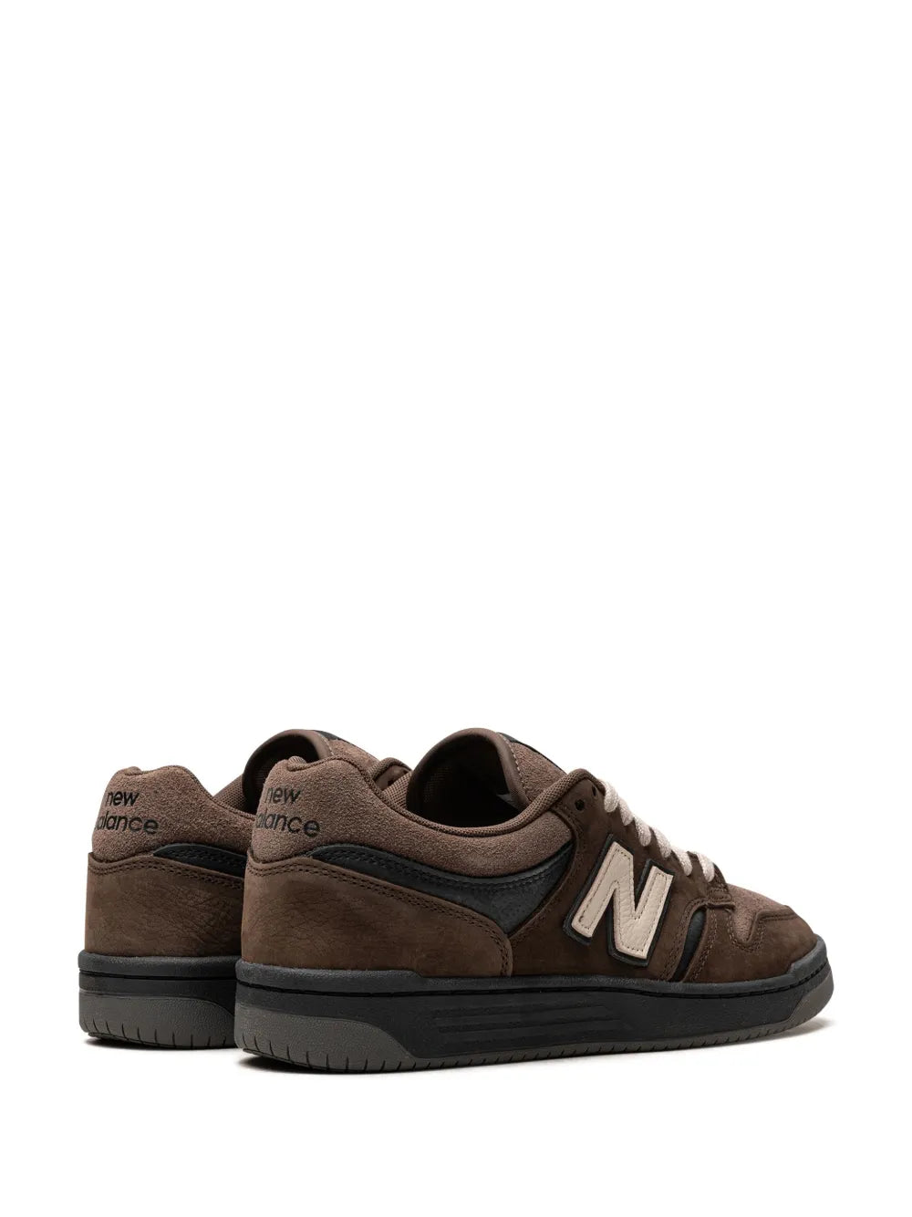 Pair of brown New Balance 480 sneakers, with N logo and white laces, rear side view.