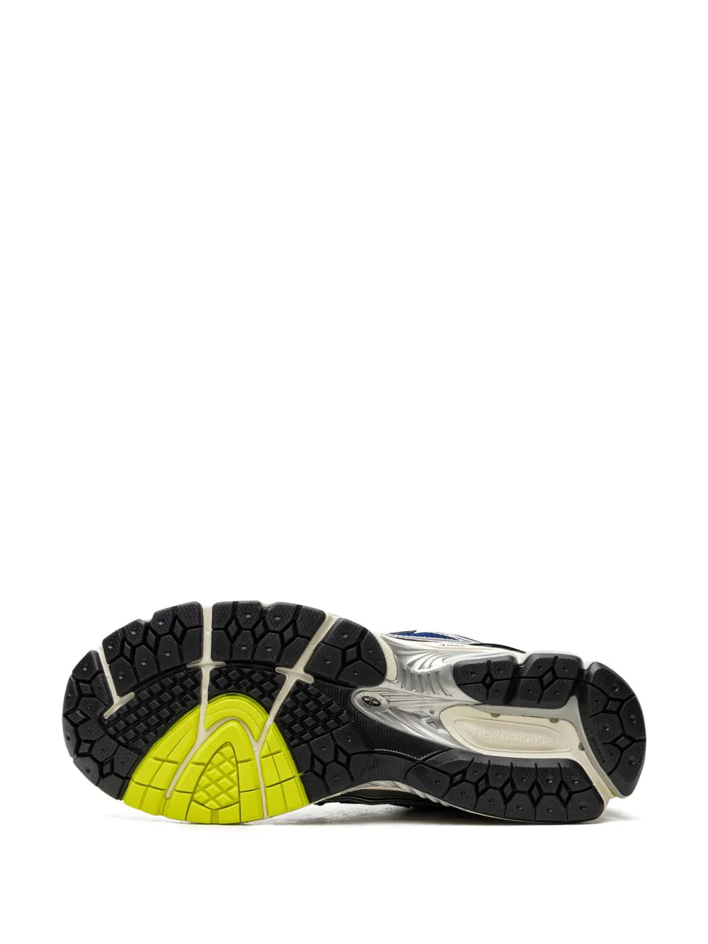 New Balance 1906R sneaker outsoles with black tread and neon green insert