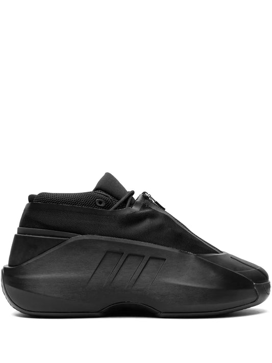 Black adidas high-top sneakers with lace-up ankle collar and side strap detail